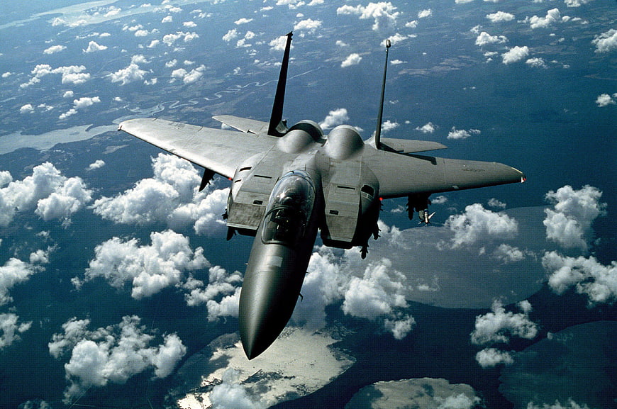 F-15 Eagle Fighter Jet Flying Above Clouds