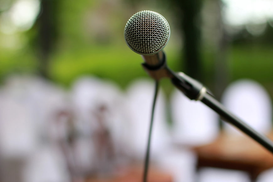 Close-up of Microphone on Stand with Blurred Background