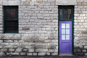 Purple Door on Old Stone Building Facade