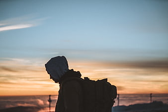 Silhouette of Hiker with Backpack at Sunset