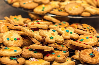 Pile of homemade Christmas cookies with colorful sprinkles