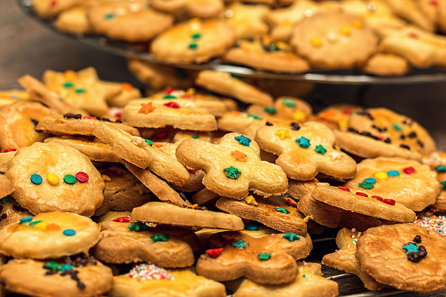 Pile of homemade Christmas cookies with colorful sprinkles