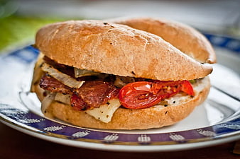 Delicious Grilled Sandwich with Tomatoes and Cheese on Plate
