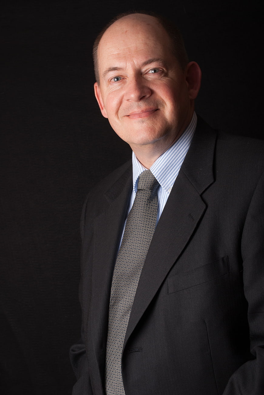 Professional Headshot of Smiling Businessman in Suit