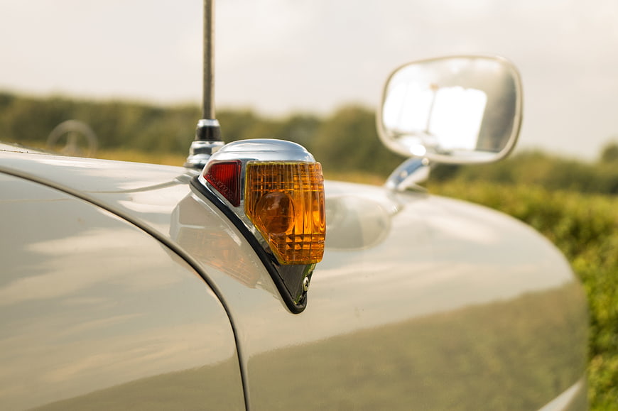 Close-up of vintage car tail fin indicator light