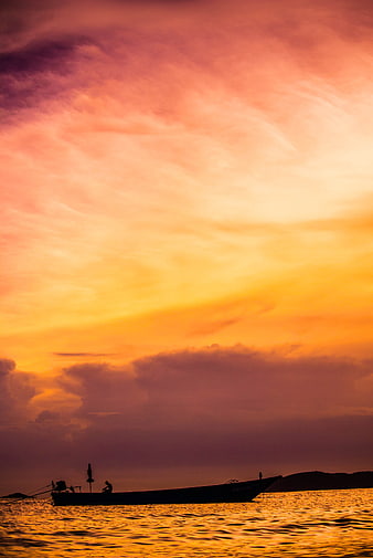Silhouette of Fishing Boat on Golden Sunset Sea