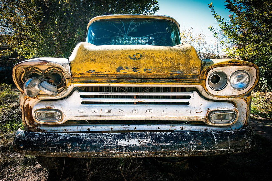 Front View of Rusty Vintage Yellow Chevrolet Truck