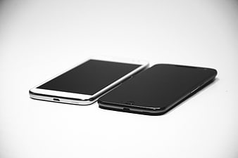Two smartphones on white background