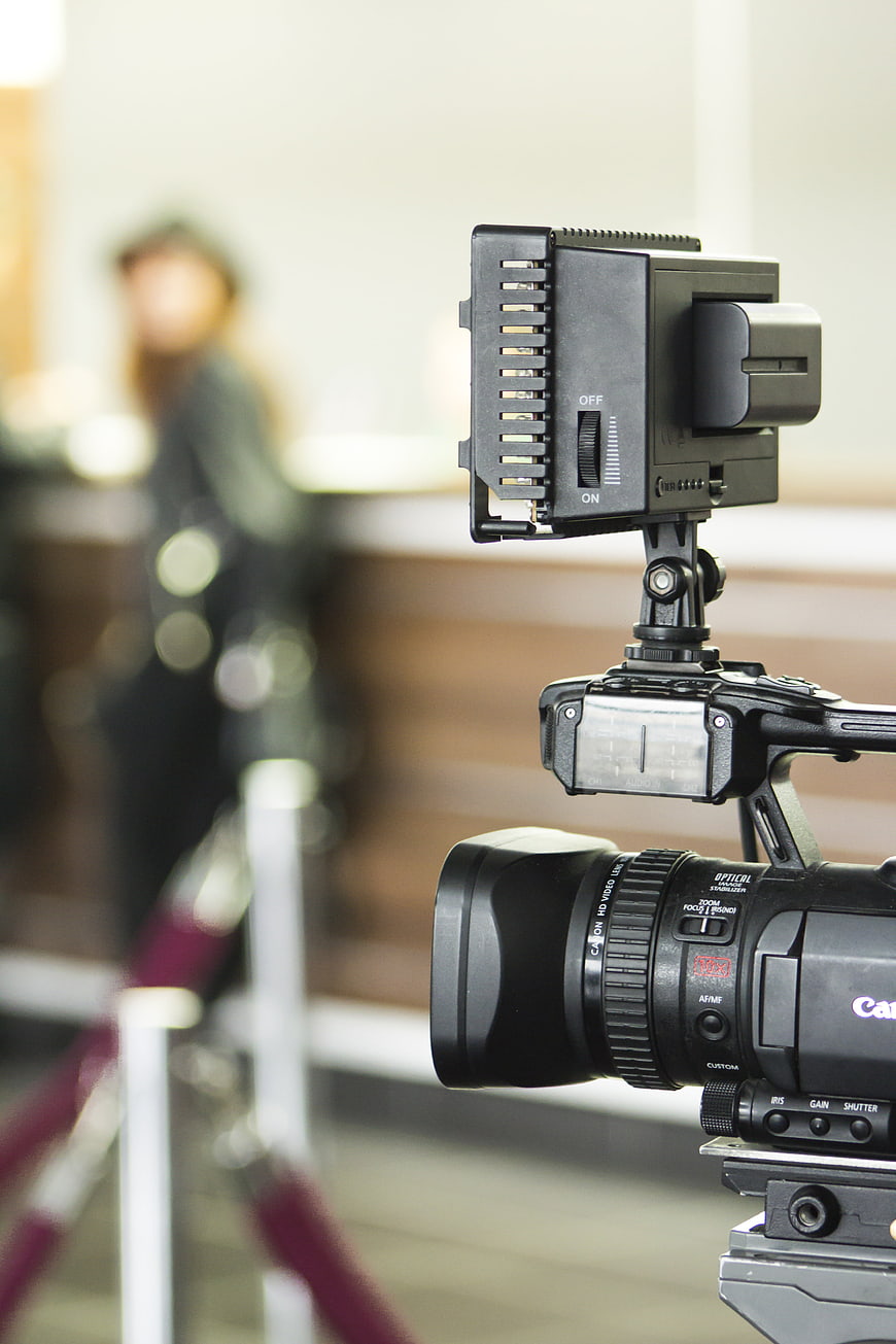 Professional Video Camera With Microphone In Studio Setting