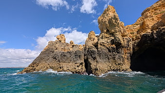 Dramatic coastal cliffs and turquoise ocean waves