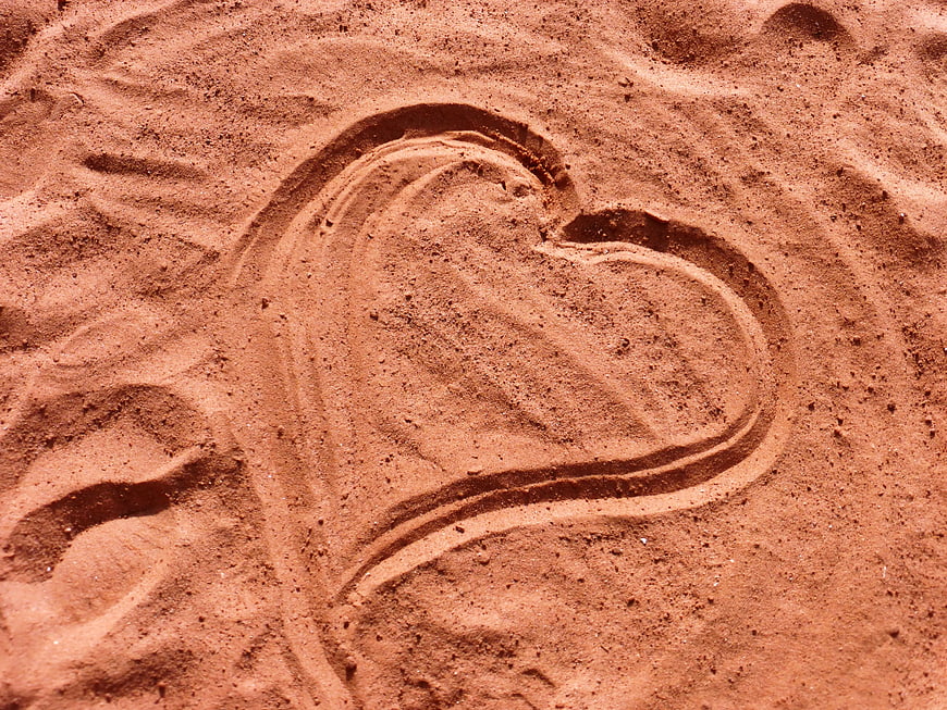 Heart drawn in sand on a beach
