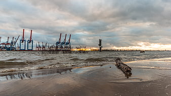 Industrial Port Cranes at Sunset on Elbe Beach Hamburg