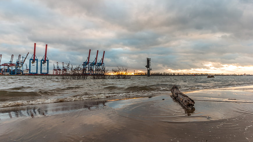 Industrial Port Cranes at Sunset on Elbe Beach Hamburg