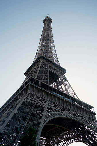 Low angle view of Eiffel Tower against blue sky