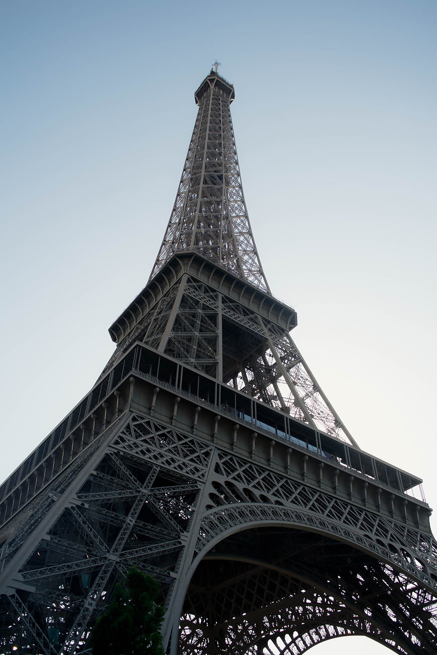 Low angle view of Eiffel Tower against blue sky