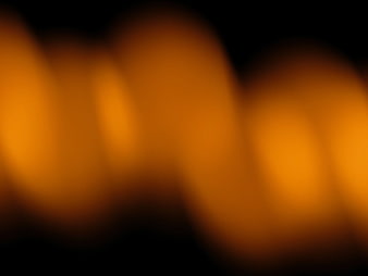 Abstract Blurred Orange Bokeh Lights on Black Background