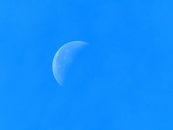 Crescent Moon in Vibrant Blue Sky