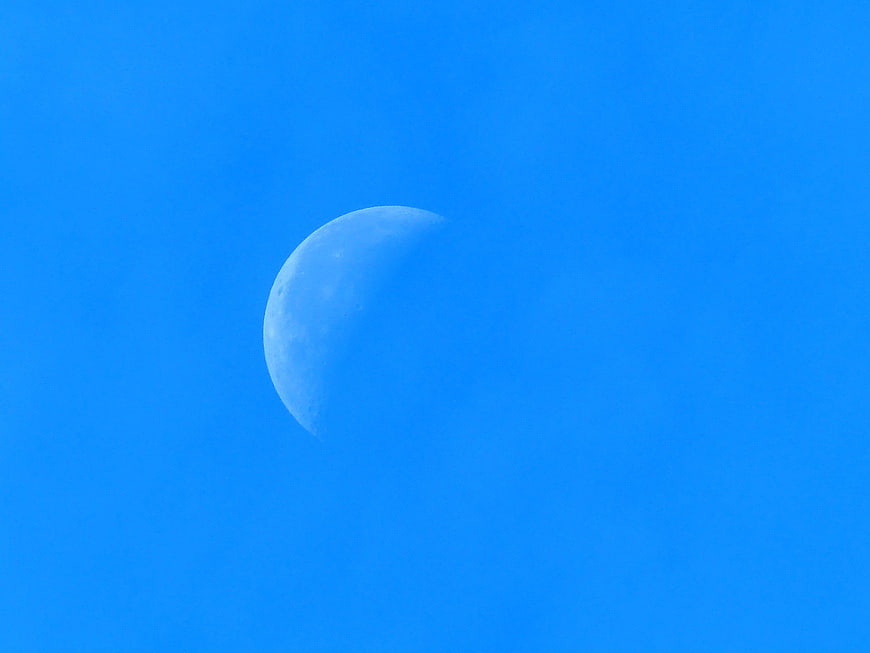 Crescent Moon in Vibrant Blue Sky