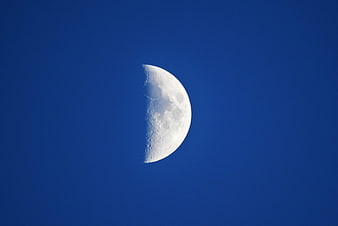 Half Moon Against Deep Blue Sky