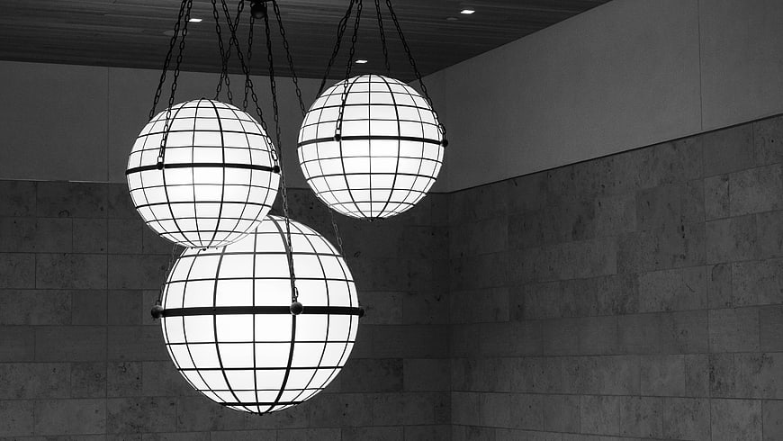 Modern spherical pendant lights hanging in interior