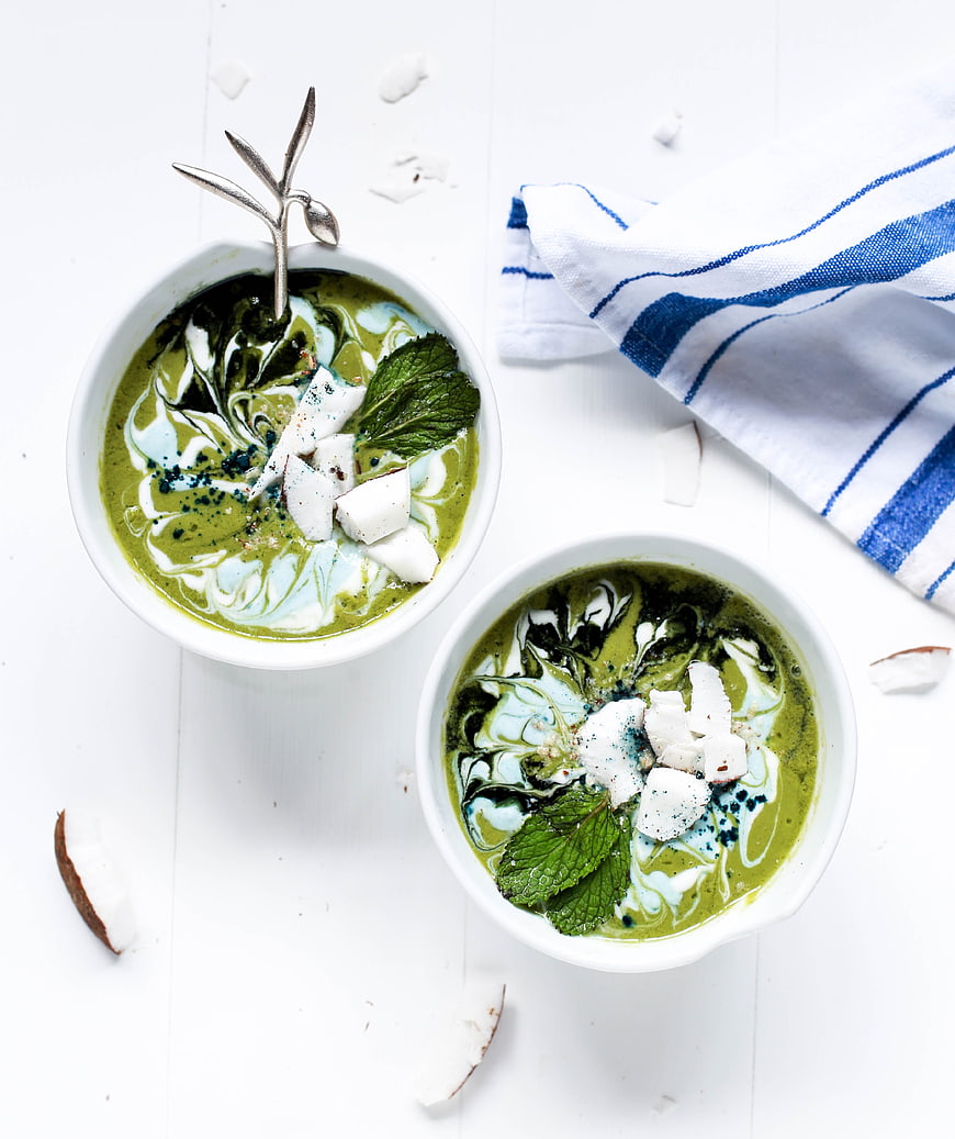 Top View of Green Smoothie Bowls with Coconut and Mint