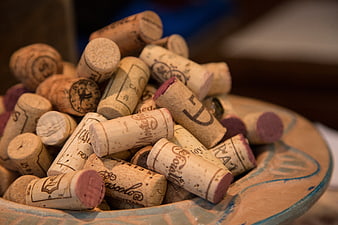 Pile of Used Wine Corks in Ceramic Bowl