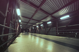 Empty Covered Pedestrian Bridge at Night