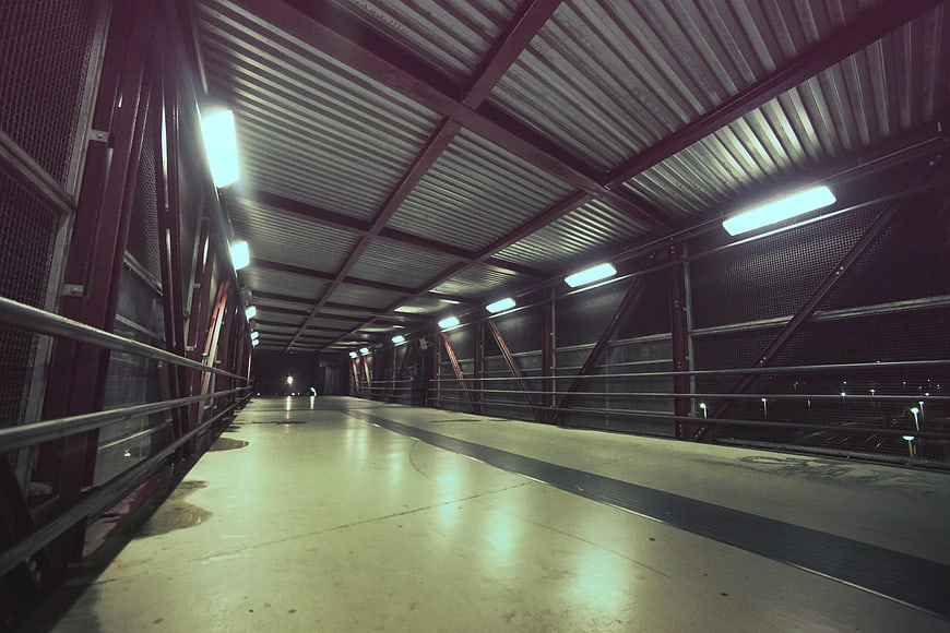 Empty Covered Pedestrian Bridge at Night