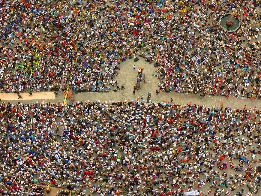 Aerial View of Massive Public Gathering in Urban Square