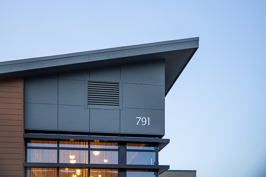 Modern House Exterior with Large Windows and Address Number