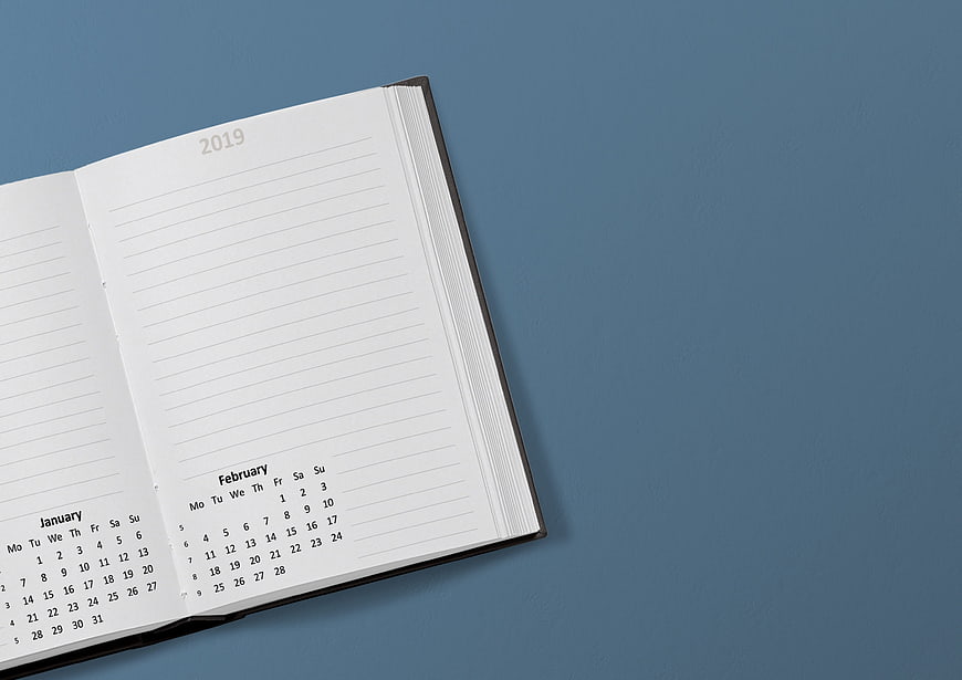 Open 2019 Planner Notebook With January And February Calendar On Blue Background