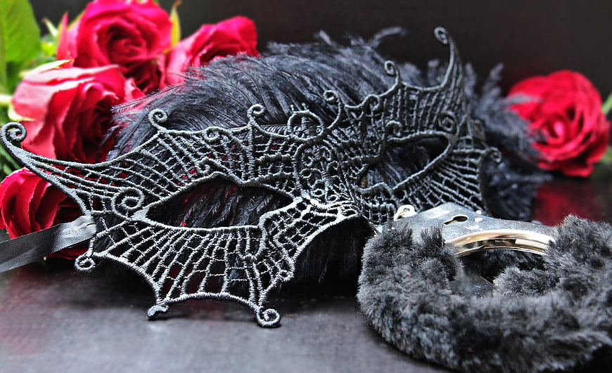 Black Venetian Mask With Feathers, Handcuffs, And Red Roses