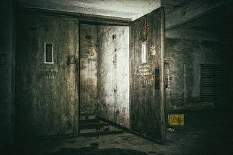 Abandoned industrial elevator shaft with heavy metal doors