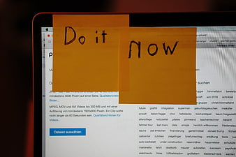 Do It Now Sticky Notes On Laptop Screen