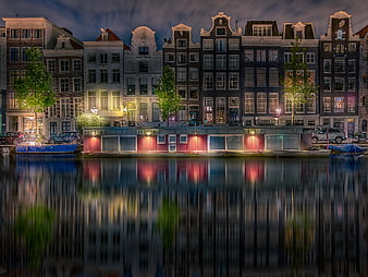 Amsterdam Canal Houses at Night with Reflections
