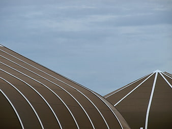 Modern Brown Dome Architecture Against Blue Sky