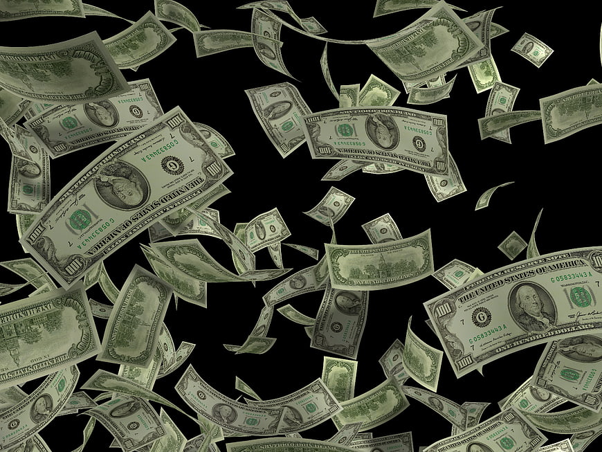 Falling US Dollar Bills on Black Background