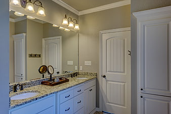 Modern bathroom interior with double vanity and granite countertop