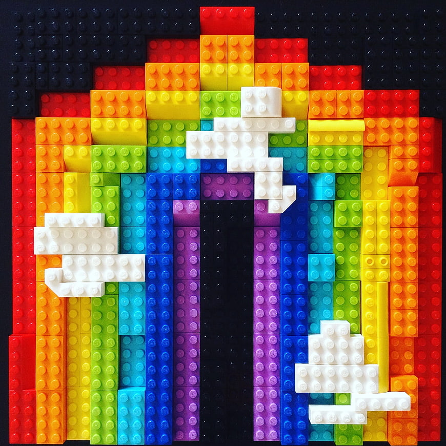 Rainbow Lego Art with White Clouds on Black Background