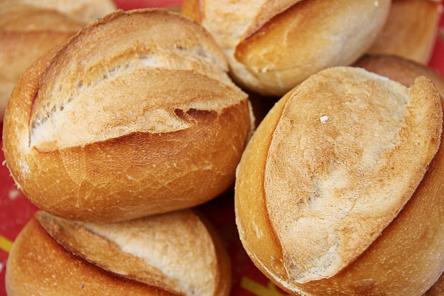 Freshly baked golden bread rolls with crispy crust