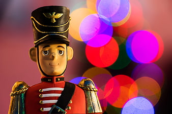 Vintage Wooden Nutcracker Soldier with Colorful Bokeh Lights