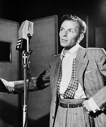 Vintage black and white portrait of Frank Sinatra singing