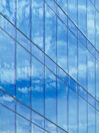 Blue Glass Building Facade with Cloud Reflections