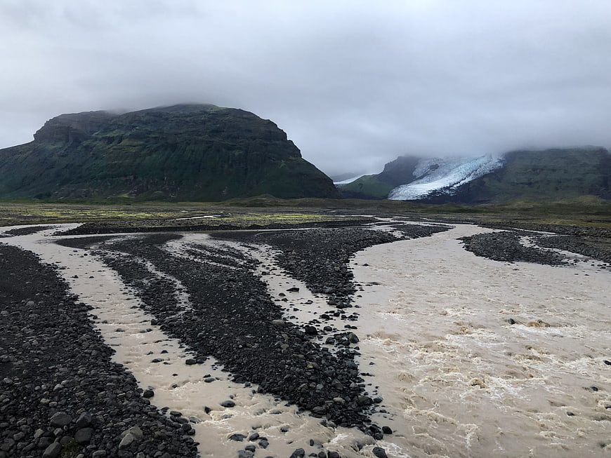 Glacial River Flowing Through Rocky Valley in Iceland