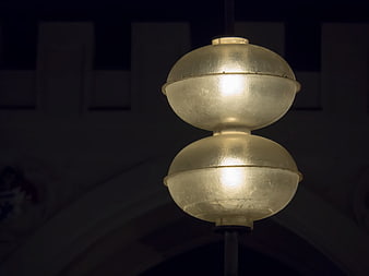 Illuminated Double Globe Street Lamp Against Dark Night Background
