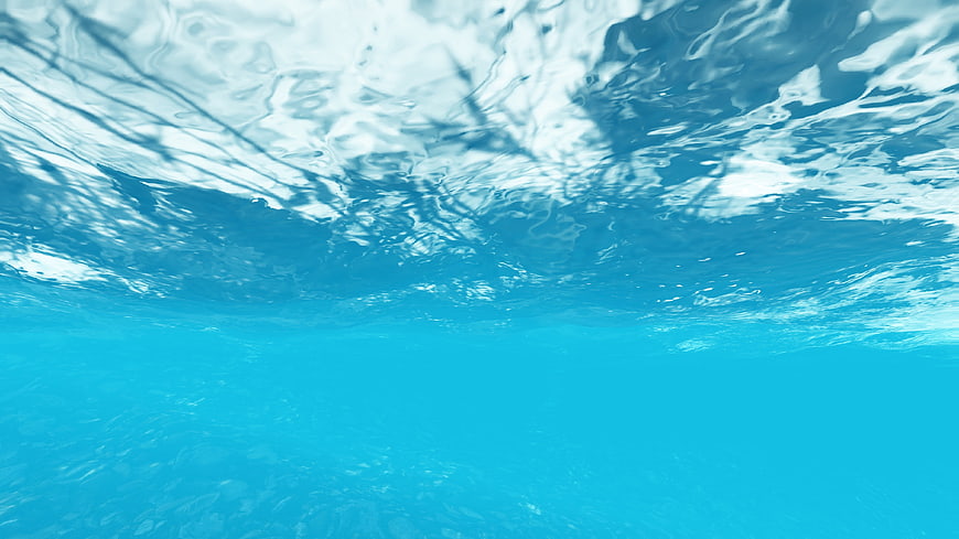 Underwater View of Blue Ocean Surface with Light Reflections