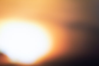 Abstract Blurred Sunset Background with Soft Orange and Yellow Light