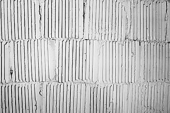 Black and white textured concrete wall pattern