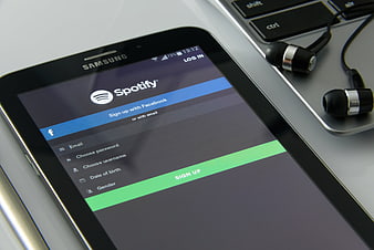 Spotify Sign Up Screen on Smartphone with Headphones
