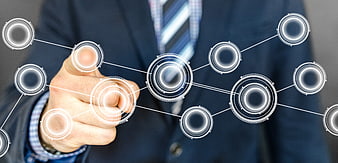 Businessman interacting with digital network interface